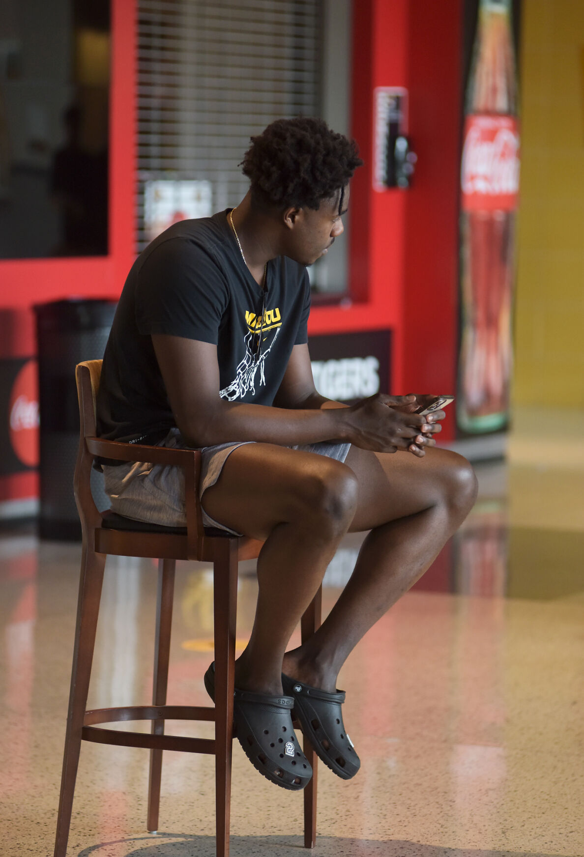 Kobe Brown sits on a chair